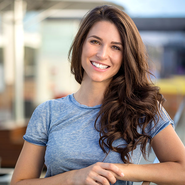 Brunette Woman Smiling Outdoors Brunette Woman Smiling Outdoors